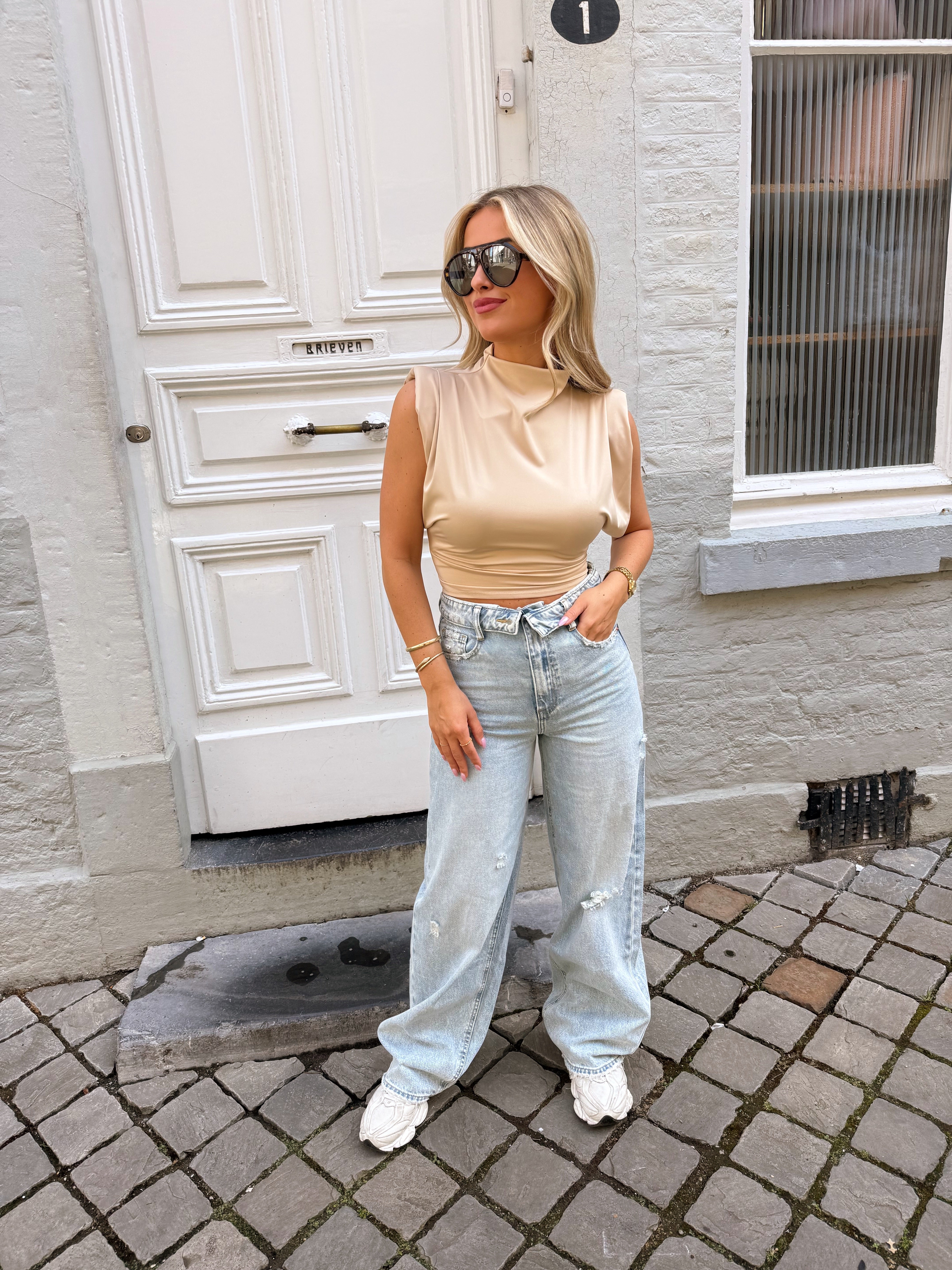 Folded ripped jeans